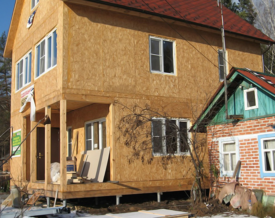 Фанера или ОБС: что выбрать? Фасадный вид здания при облицовке ОСБ